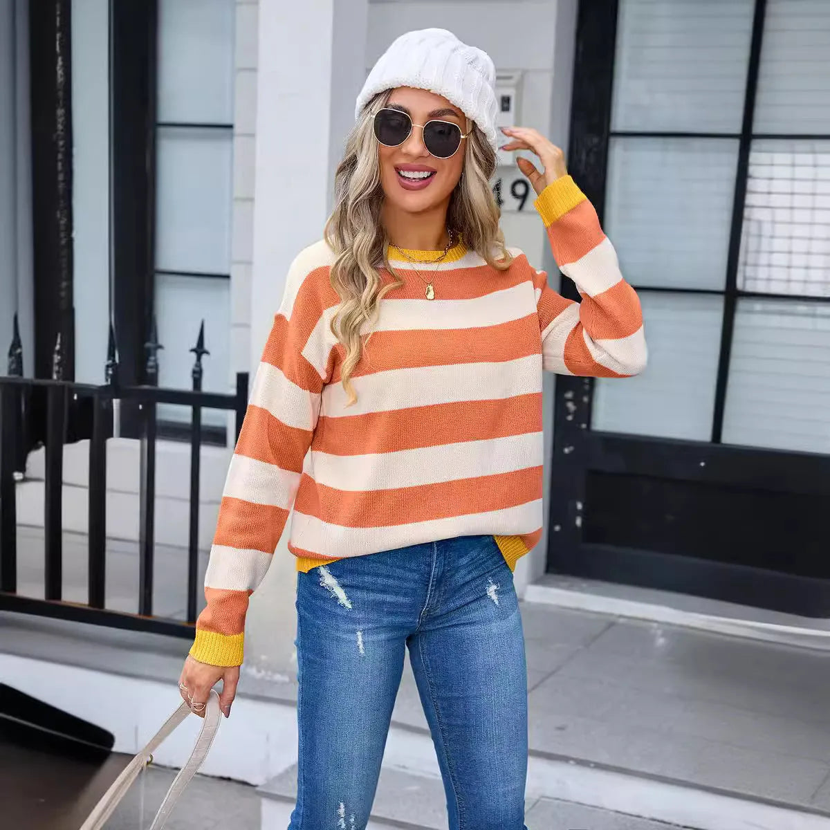Women's loose striped acrylic sweater in blue colour with round neckline and long sleeves