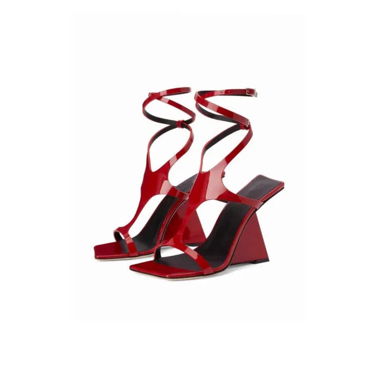 Women's black summer sandal with 9.5cm heel, square toe, and button fastening on a white background.