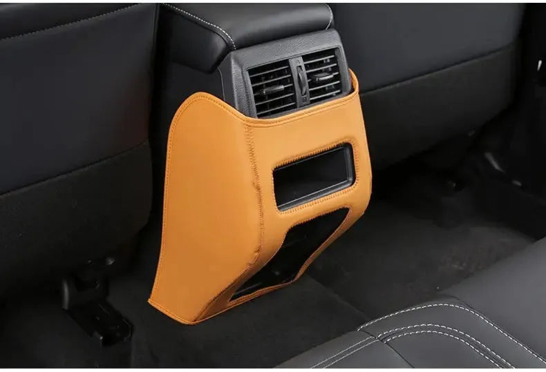 Set of three leather anti-kick pads for a Mitsubishi Outlander car seat armrest and box.