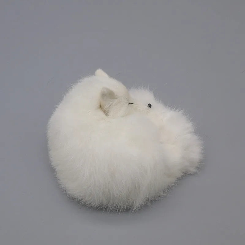 Artificial white fox fur car decoration on vehicle dashboard showing soft texture and compact size