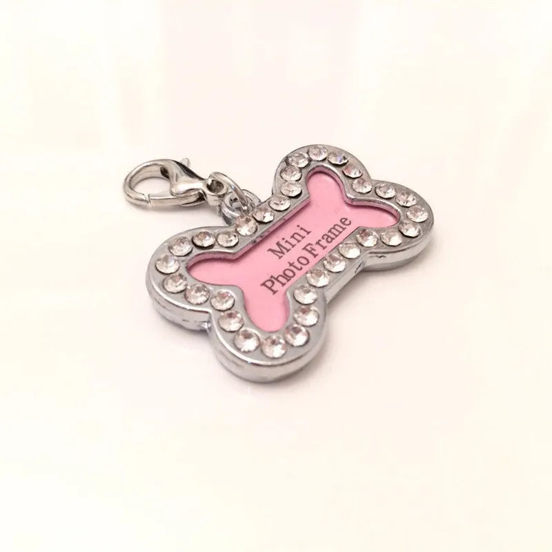 Pink metal dog pendant necklace with bone pattern diamond charm on display