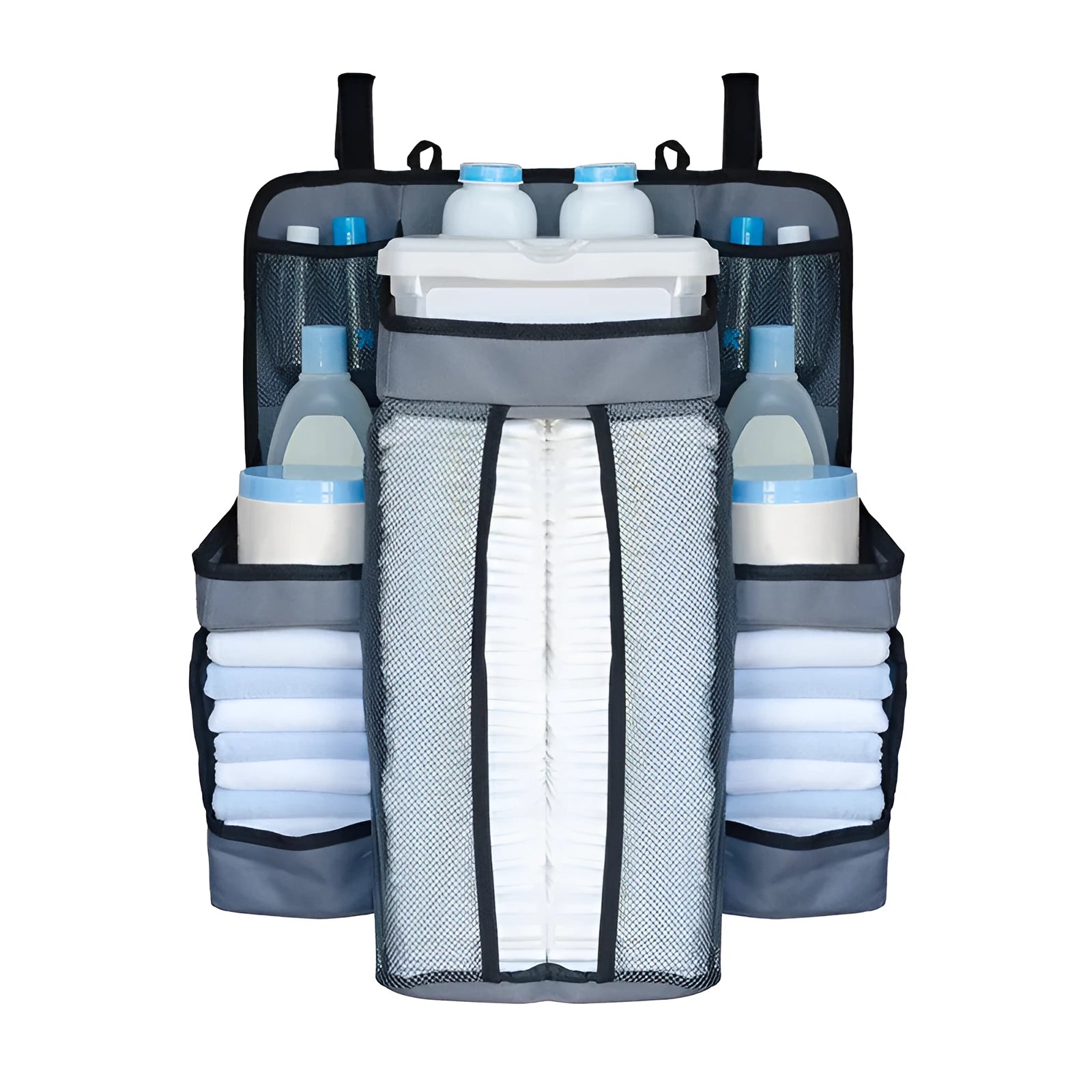 Gray baby diaper organizer hanging on a crib rail with compartments for nappies and wipes