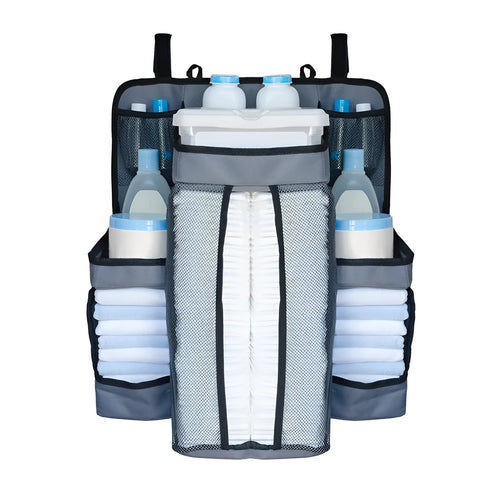 Gray baby diaper organizer hanging on a crib rail with compartments for nappies and wipes