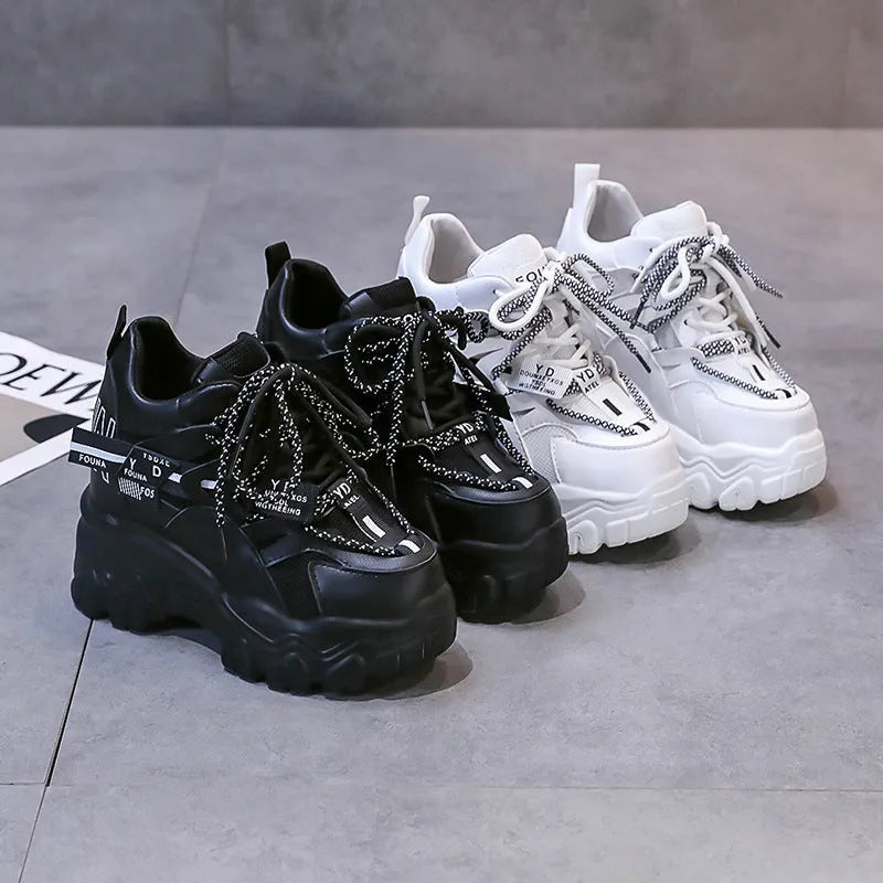 Women's white breathable mesh platform sports shoes with cross strap and rubber sole.