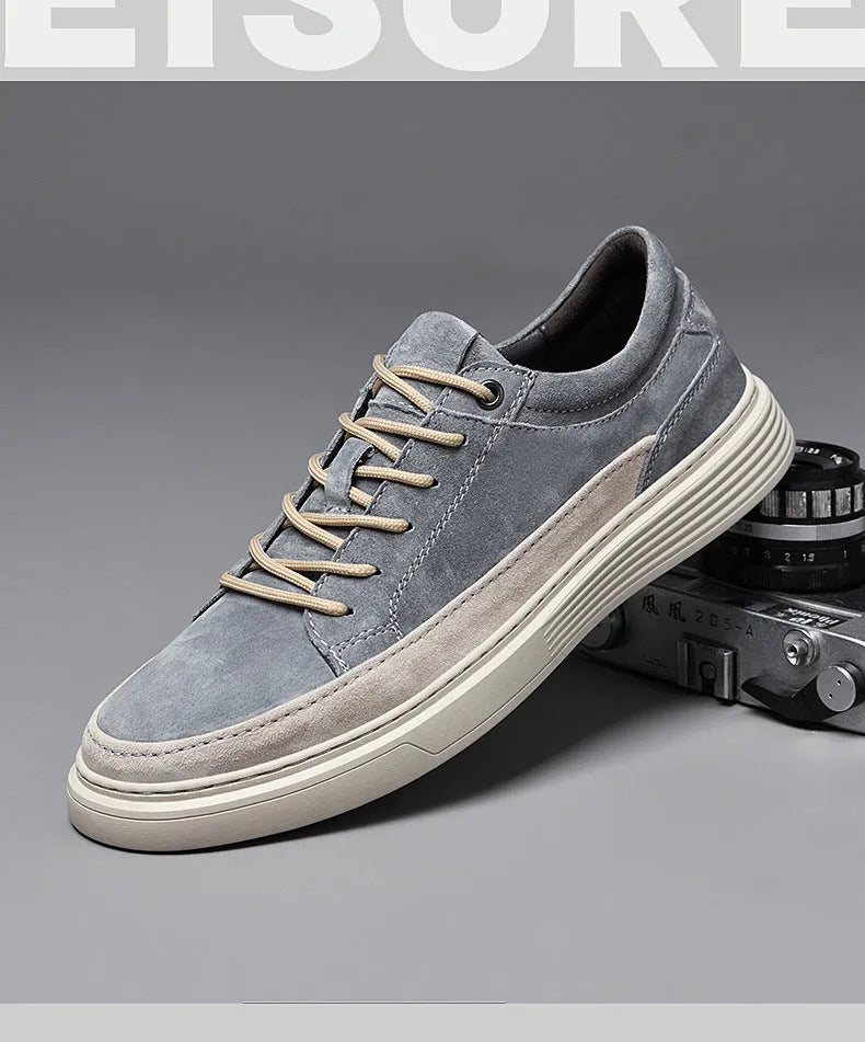 Men's grey casual leather skate shoes with round toe, low top design and rubber soles
