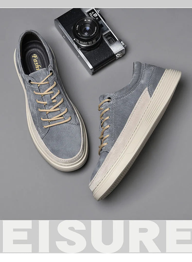Men's grey casual leather skate shoes with round toe, low top design and rubber soles