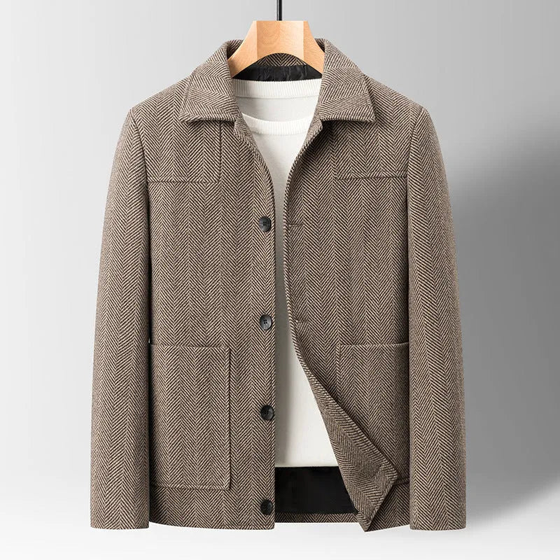 Men's slim lapel woolen jacket in gray with non-ironing finish and side patch pockets on a plain background