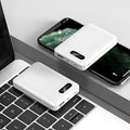 White and black portable power bank with multiple capacity options and USB charging ports