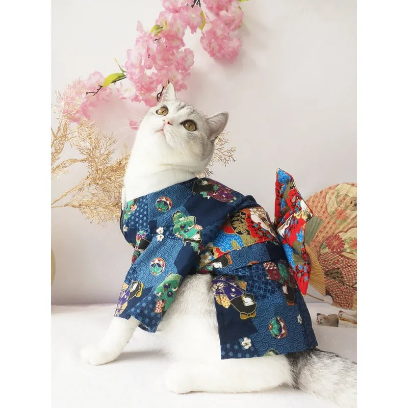 Small dog wearing a cherry blossom print kimono-style pet clothing in a standing pose