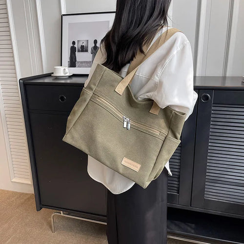 Canvas shoulder bag for women with contrast stitching and double shoulder straps, available in grey