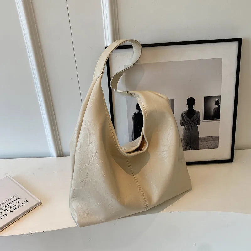 Casual soft leather shoulder bag with large capacity and sandwich pocket in street trend style