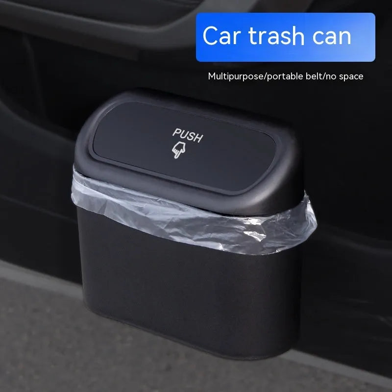 Folding car trash can in black waterproof plastic on car seat for waste collection