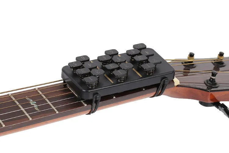 Guitar Aid plastic string press for guitar chord practice and rebound assistance