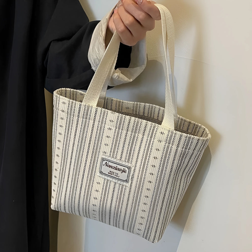 Japanese-style corduroy shoulder bag in dark brown, showing the textured fabric and adjustable strap.