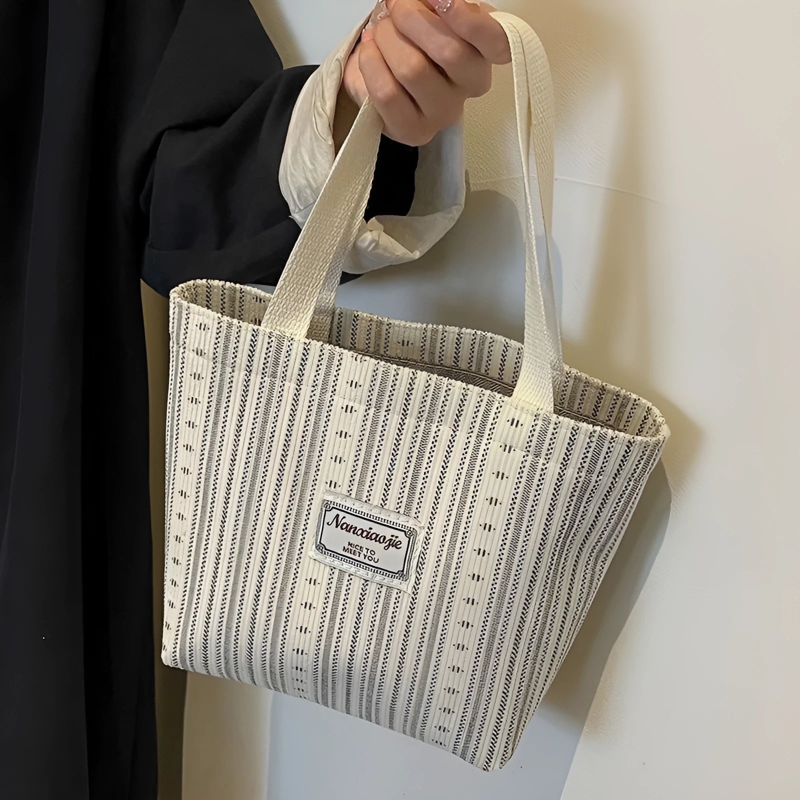 Japanese-style corduroy shoulder bag in dark brown, showing the textured fabric and adjustable strap.