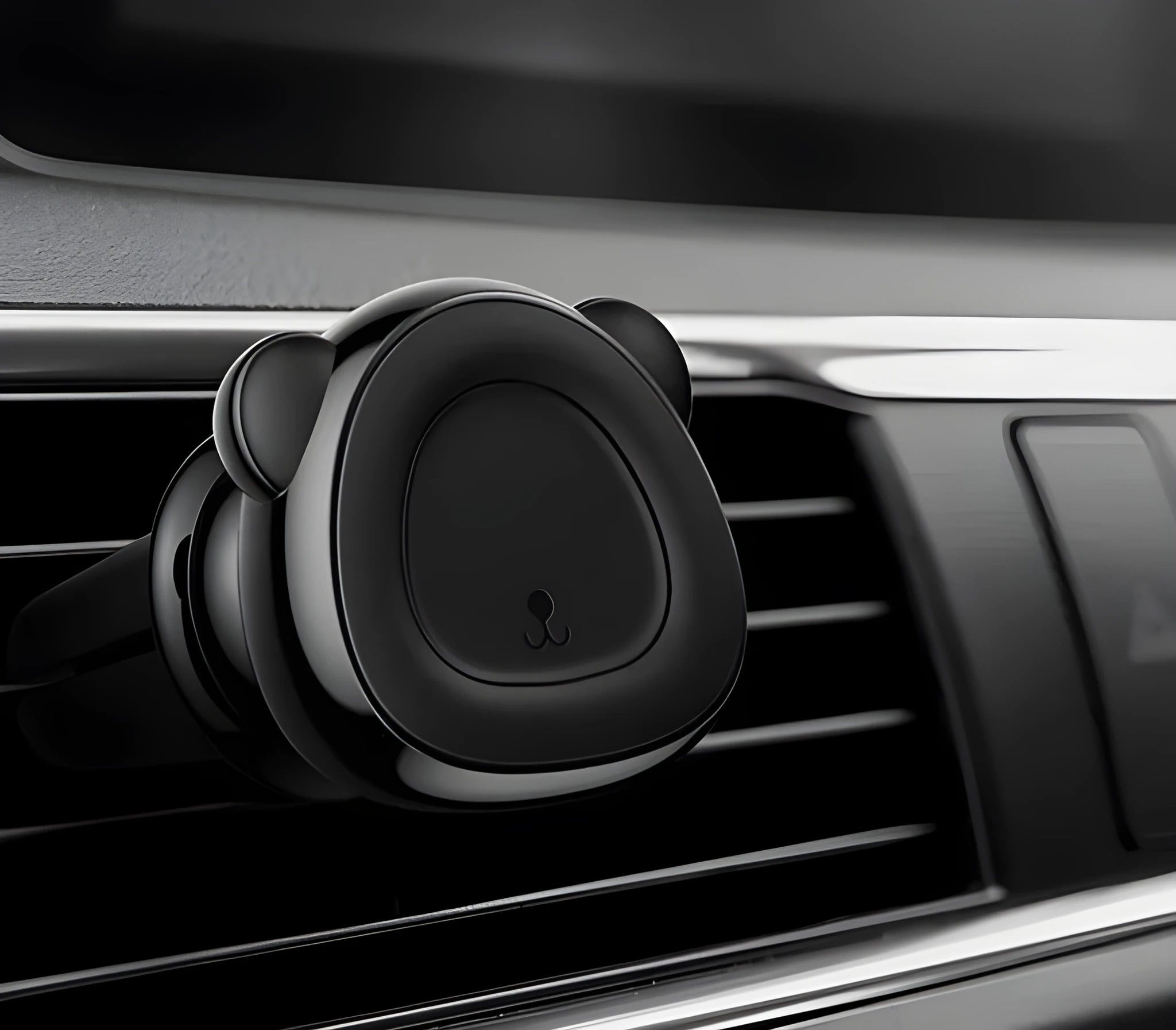Baby Bear Magnetic Car Phone Holder in black with a phone attached on a car dashboard