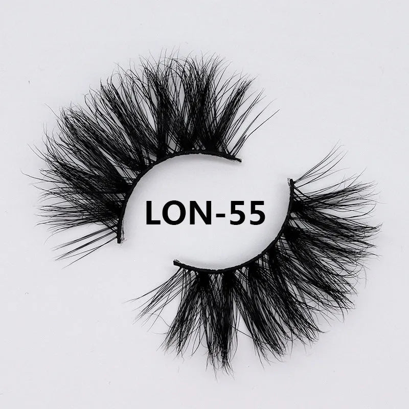 25MM3D handmade mink eyelashes in a clear plastic tray showing 25mm length 3D curl design