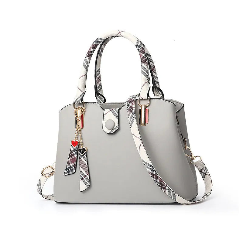 Large-capacity ladies PU Boston handbag with zipper and metal trim, medium size, available in multiple colours
