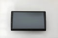 Black Android car stereo with touch screen display showing GPS navigation interface