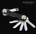 Multi-function metal keychain with stainless steel and anodised aluminium finish, featuring split ring and carabiner, in grey colour option.