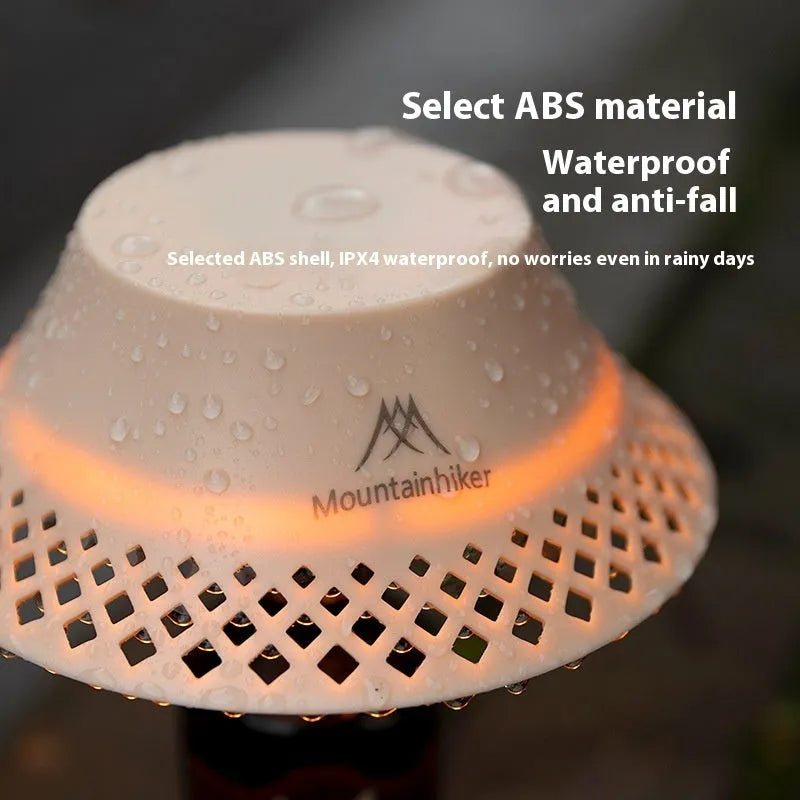 Beige wine bottle shaped camping lantern with USB-C charging port and compact dimensions