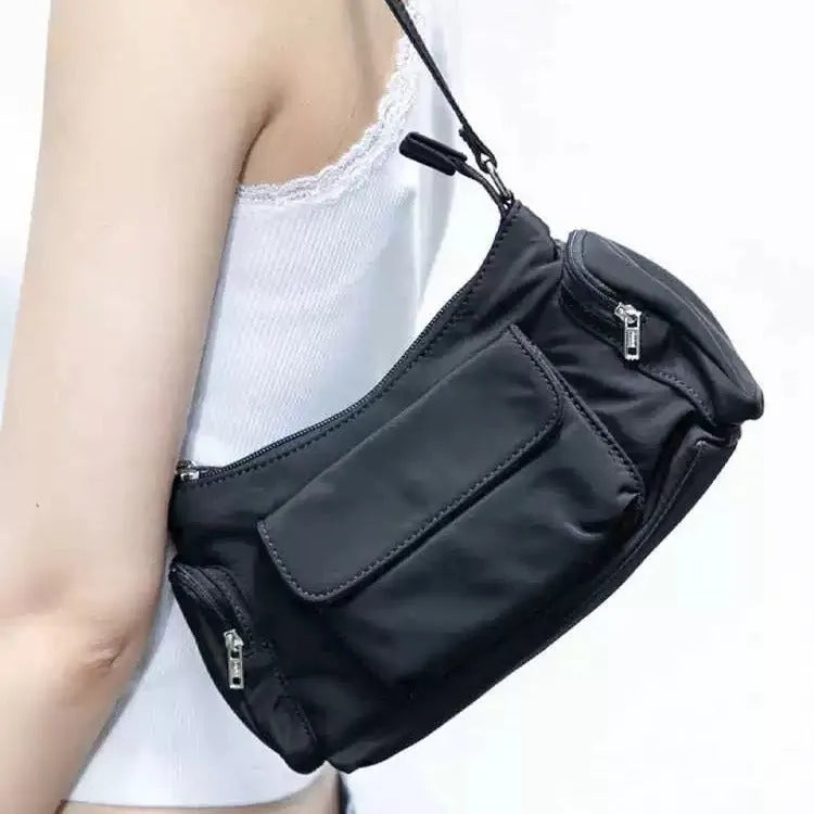 Black PU nylon double pocket shoulder bag with side line detail showing compact dimensions