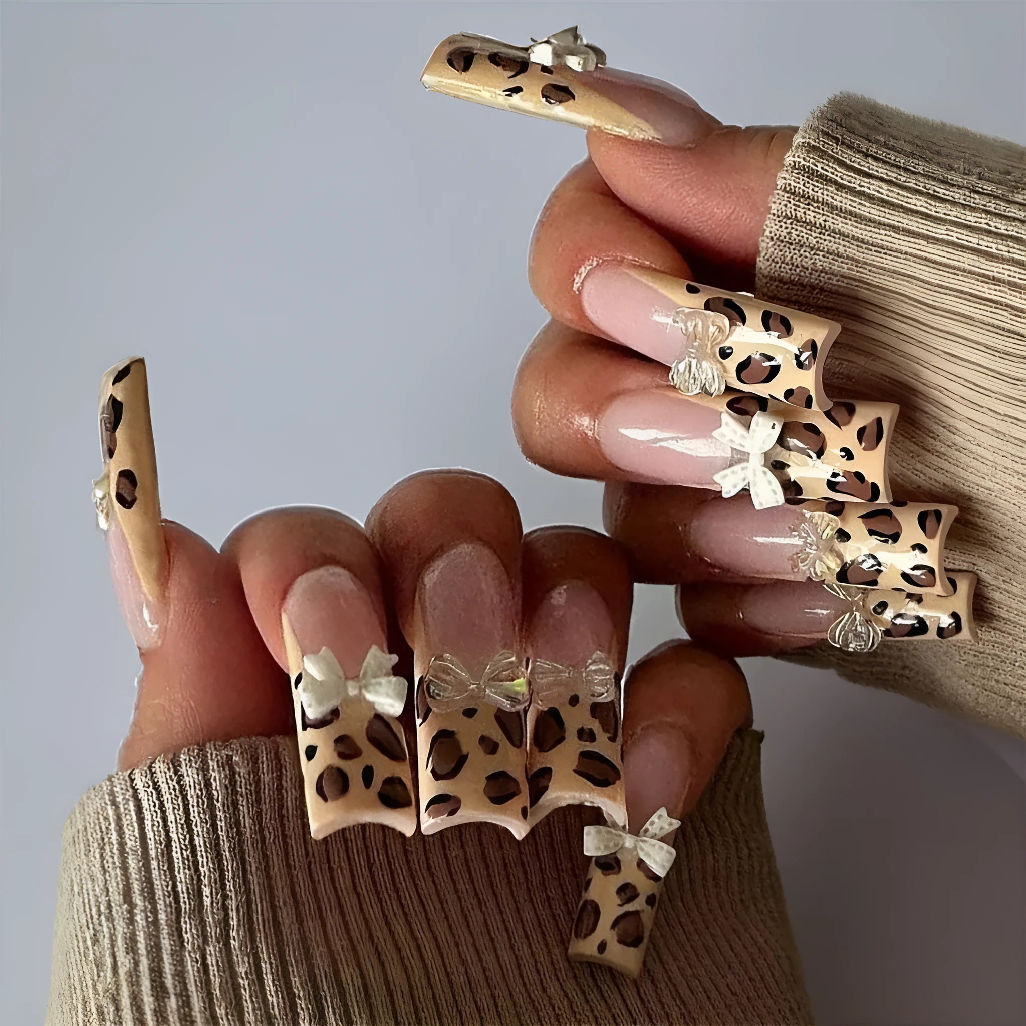 Leopard print butterfly shaped plastic nail art decorations in WM296 colour, pack of 60 pieces.