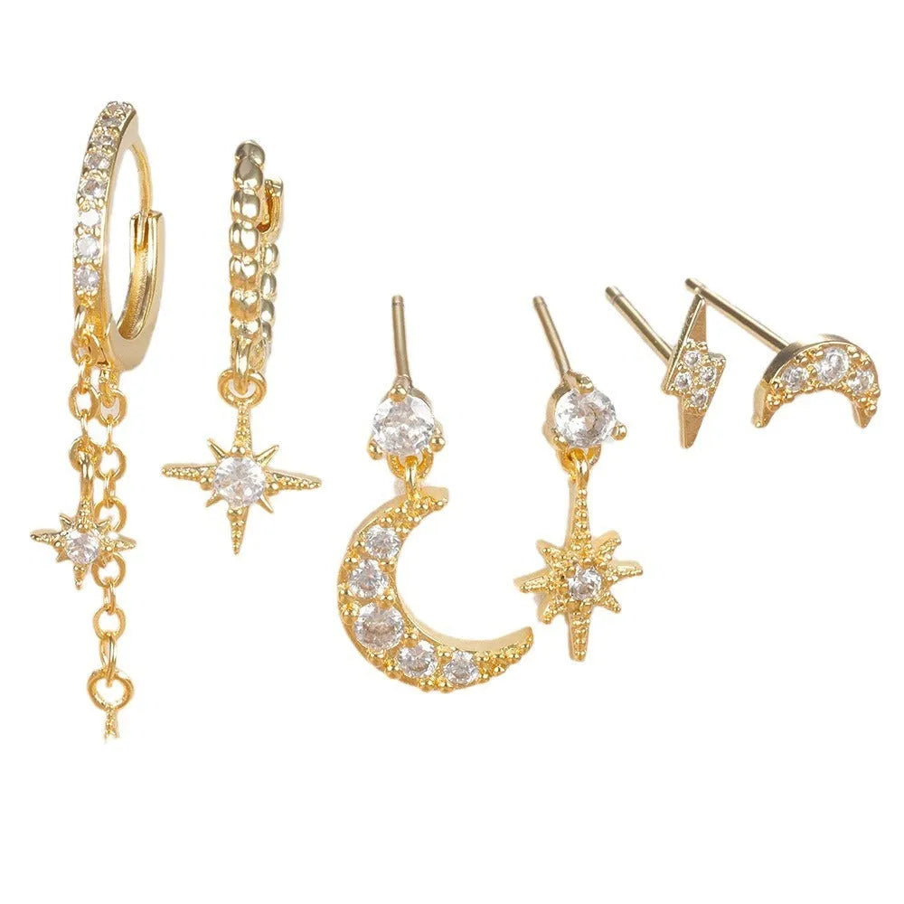XINGX set of six gold electroplated chain tassel earrings with zircon studs on display