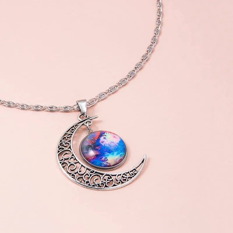 Silver hollow moon pendant necklace with glass star insert on Figaro chain for women