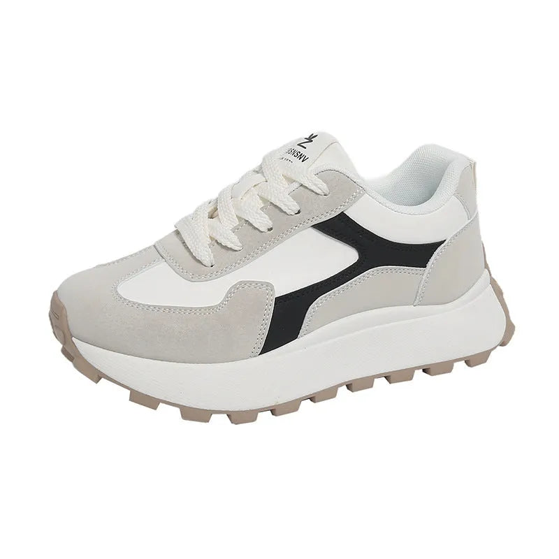 Women's low-top platform running shoes in black, red, or grey with lace-up front and flat rubber sole.