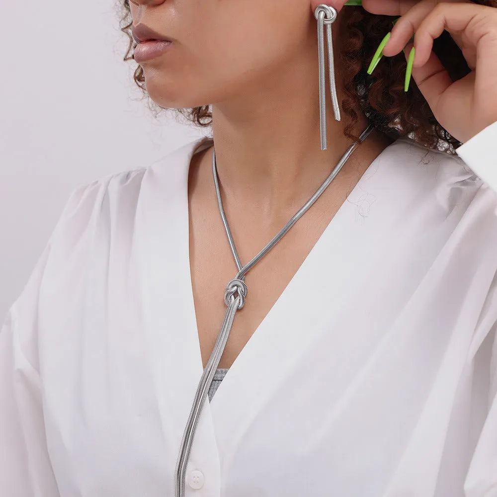 Gold knotted tassel pendant on snake chain necklace with matching earrings