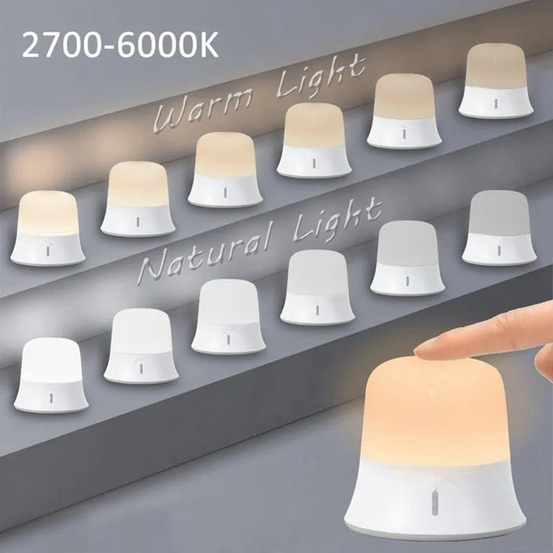 White touch-control bedside night light with motion sensor on a wooden table.