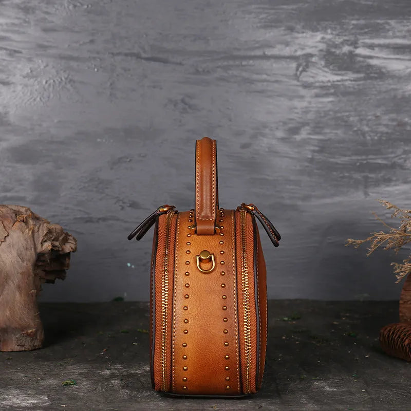 Vintage-style suede cowhide leather handbag with multiple internal organisation pockets.