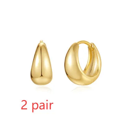 Golden brass diamond earclip earrings with geometric round design and butterfly backings