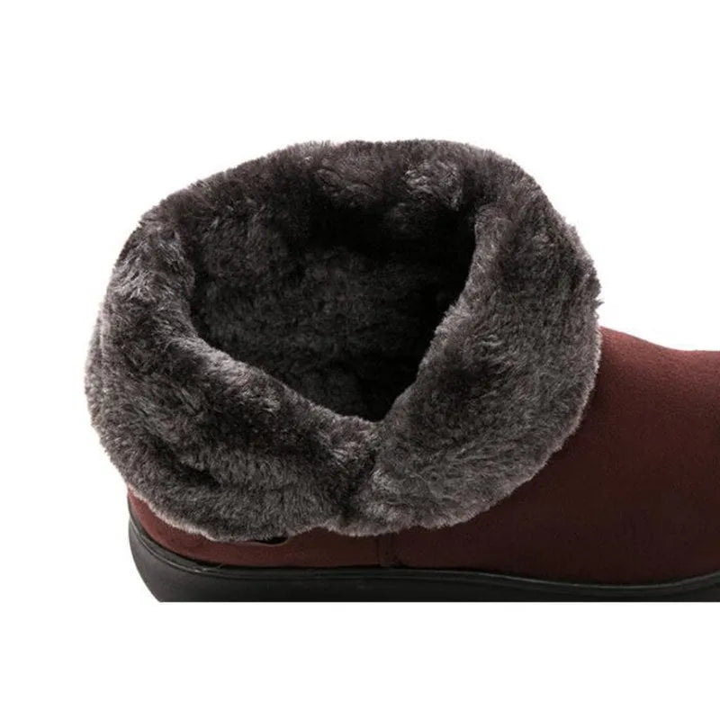 Women's winter flock ankle snow boots with button closure, rubber sole, and low platform in solid colour