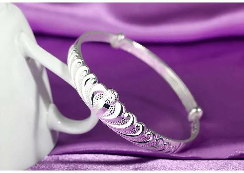 Silver electroplated crown bracelet for women on white background