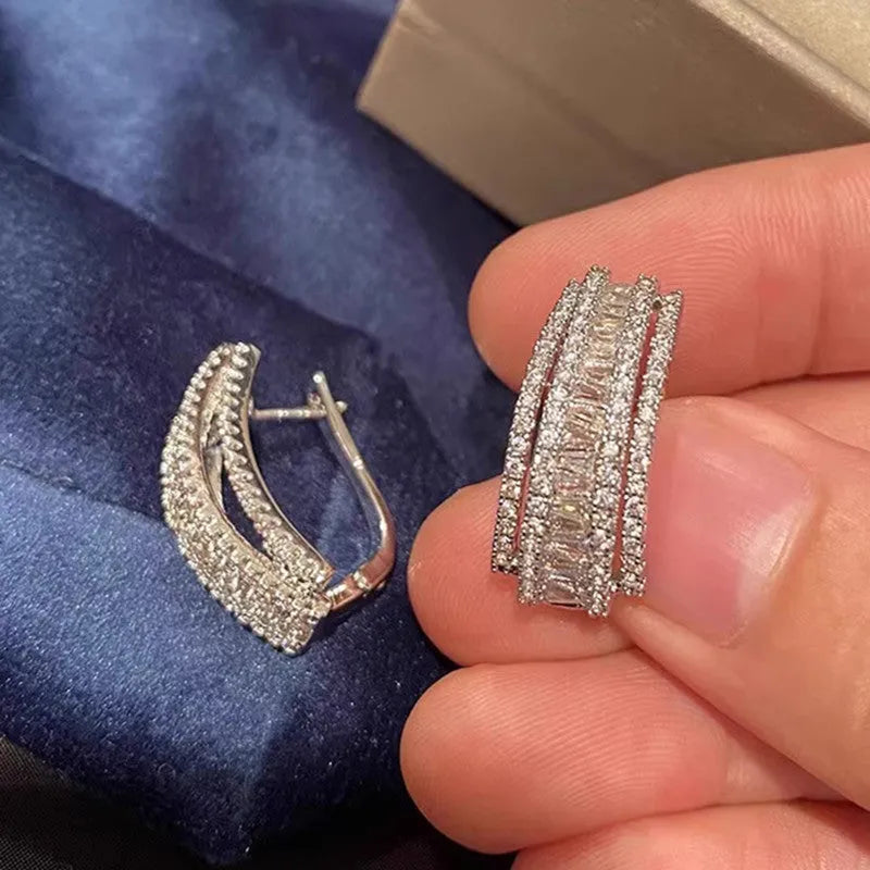 Geometric stud earrings with inlaid zircon stones in white gold colour