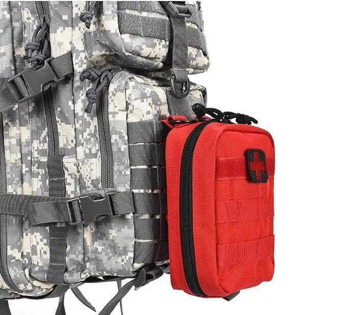 Army green nylon tactical medical accessory pouch with hook-and-loop fastening, shown next to a tape measure.