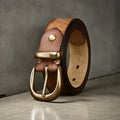 Men's black genuine cowhide casual belt with copper pin buckle on a jeans background