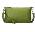 Structured cowhide lady slant bag in apricot colour with hand strap and shoulder strap, showing slim profile.