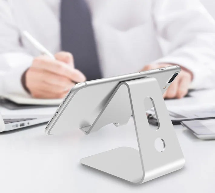 Metal aluminium alloy phone stand holding a mobile phone, available in black, red, rose gold, and silver colours