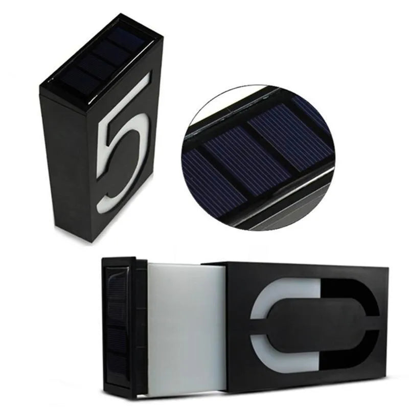 Solar powered outdoor house number light with LED illumination and concealed mounting design