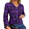 Woman wearing a loose-fit purple plaid casual shirt with regular sleeves.