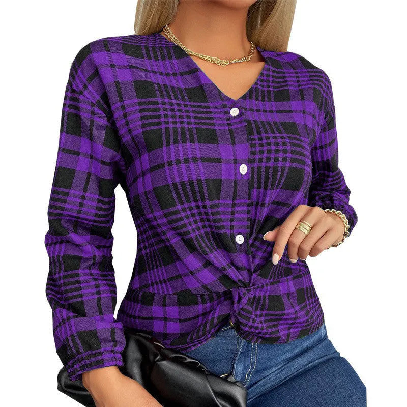 Woman wearing a loose-fit purple plaid casual shirt with regular sleeves.