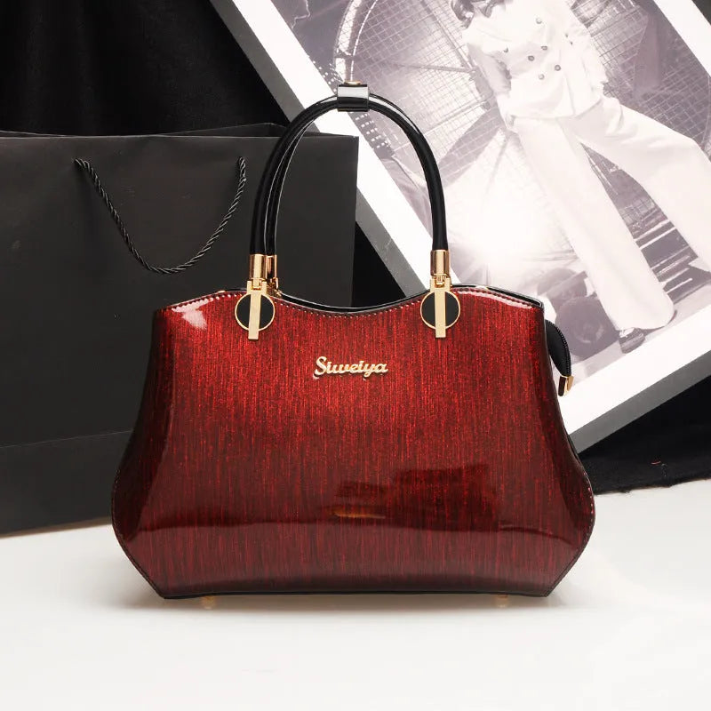 Women's medium horizontal square handbag with zipper closure and printed design, available in multiple colour options