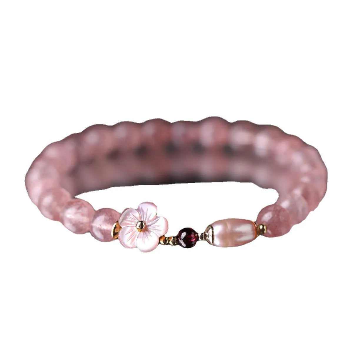 Strawberry quartz peach blossom bracelet with crystal flower charm and gemstone beads.