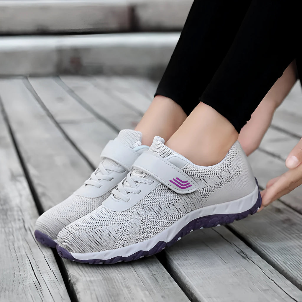 Women's gray purple low-top casual shoes with velcro strap and wedge heel.