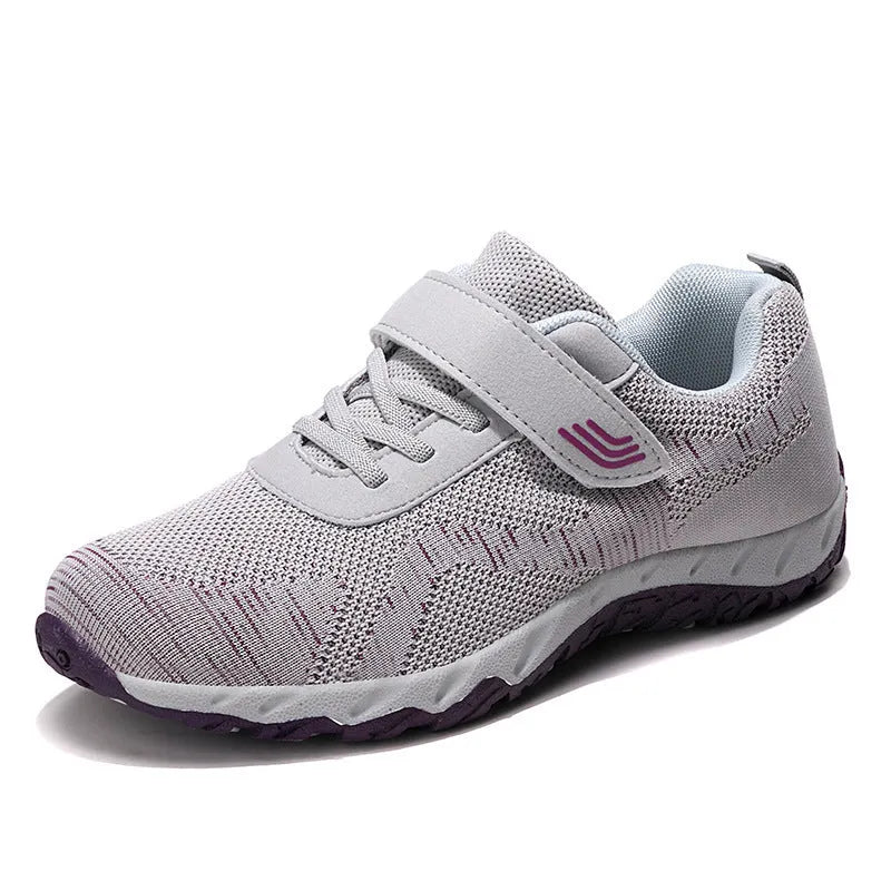 Women's gray purple low-top casual shoes with velcro strap and wedge heel.