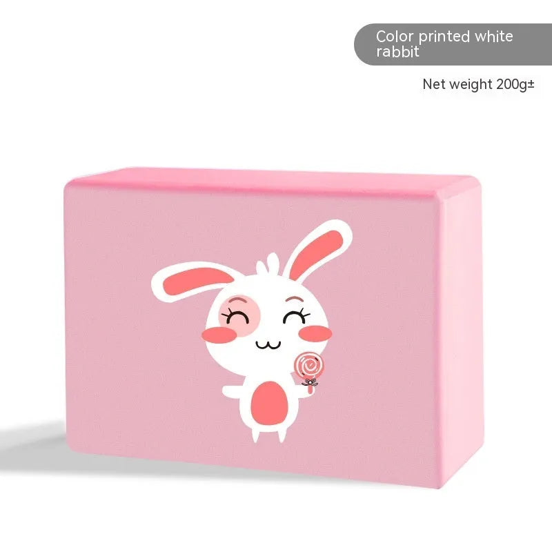 High-density EVA foam yoga block in various colours and prints on a workout mat.