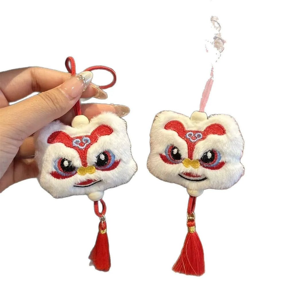 Blue and yellow handmade plush lion keychain with star stones and tassels in Chinese cartoon style